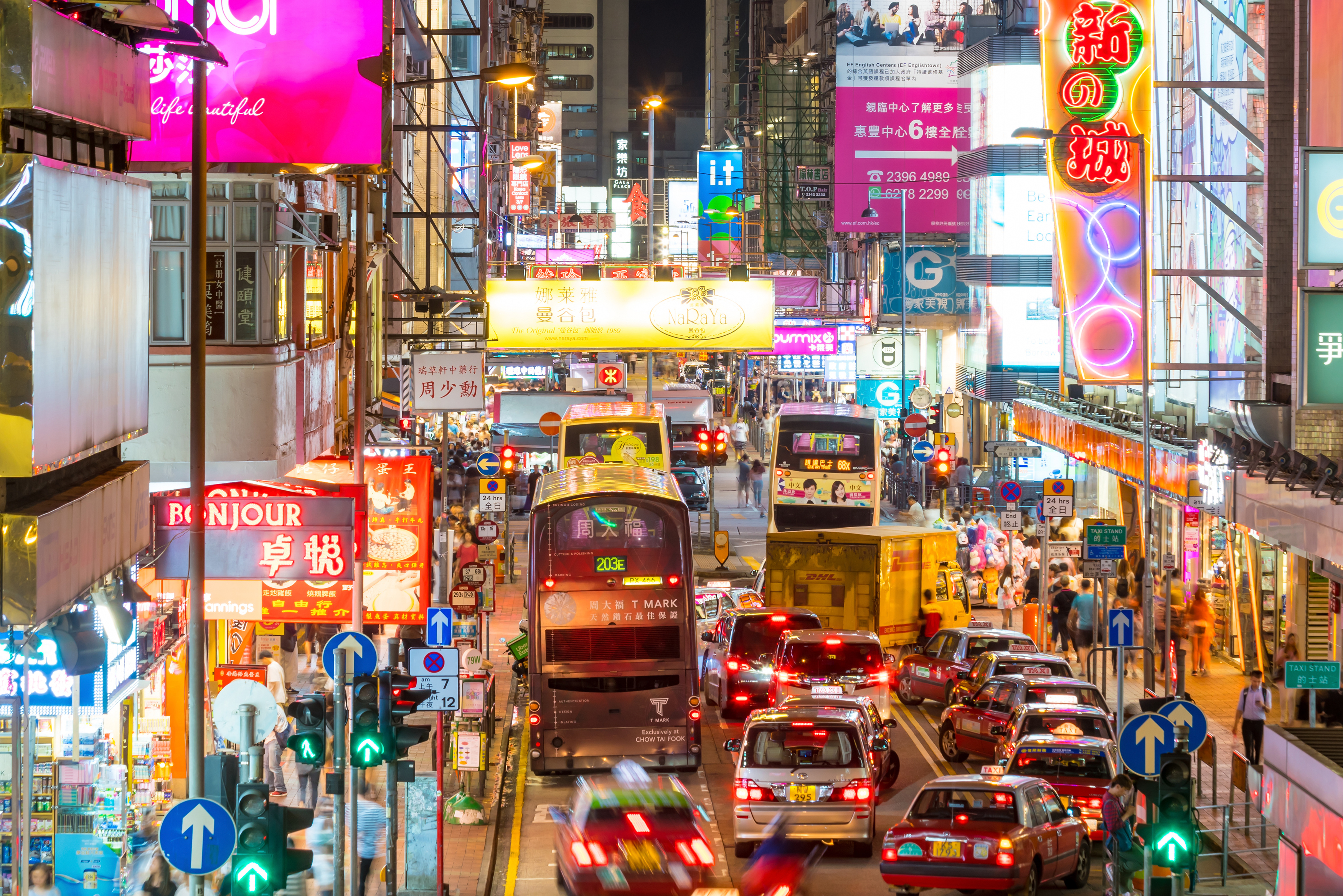 An image showing a busy Hong Kong street at night.