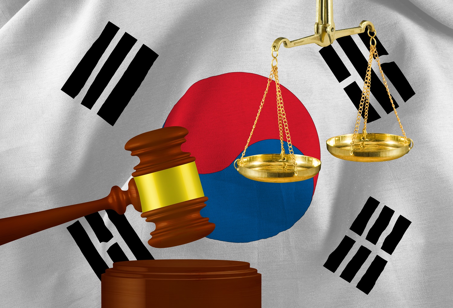A judge&amp;amp;rsquo;s gavel and scales against a background of the flag of South Korea.