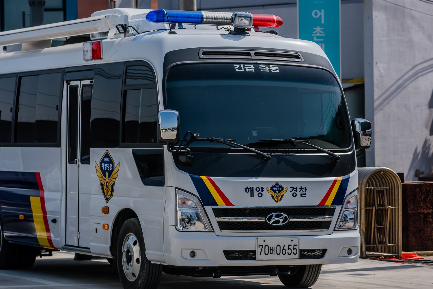 A South Korean police bus on an urban street.