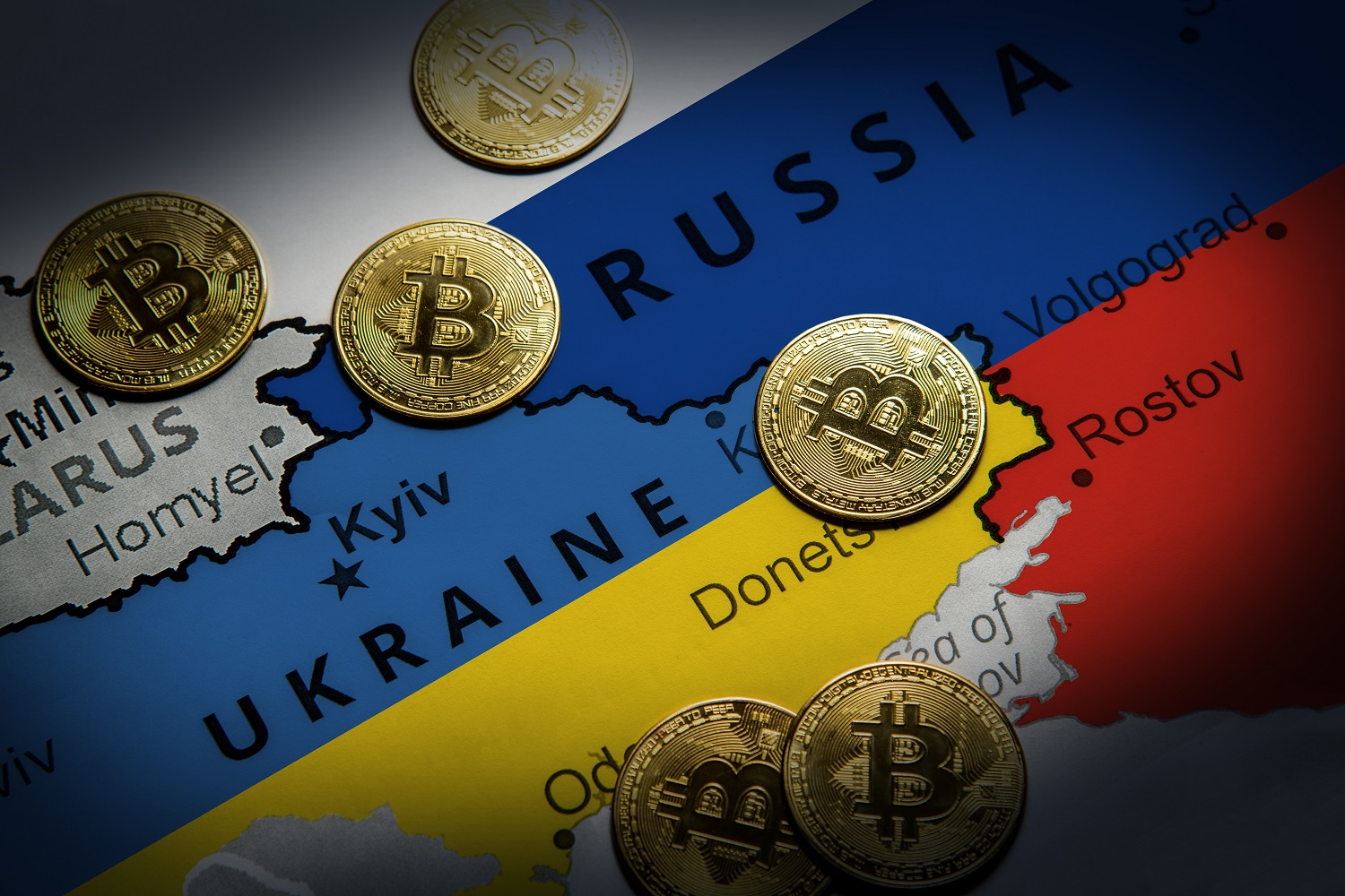 Tokens intended to represent Bitcoin on a map of Russia and Ukraine, with each nation colored in the hues of its national flag.