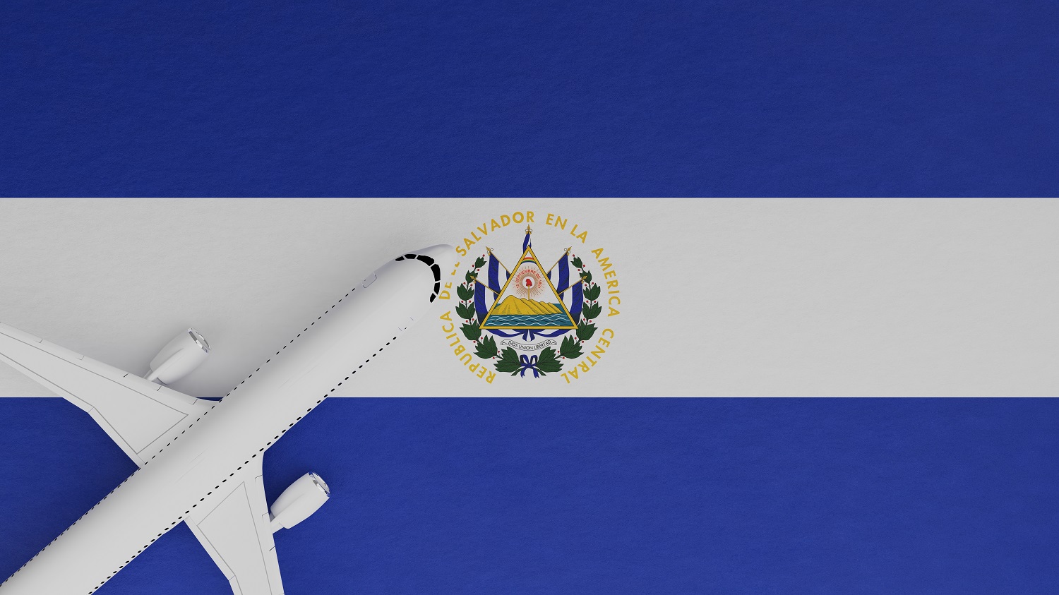 A top-down view of a plane on top of the national flag of El Salvador.