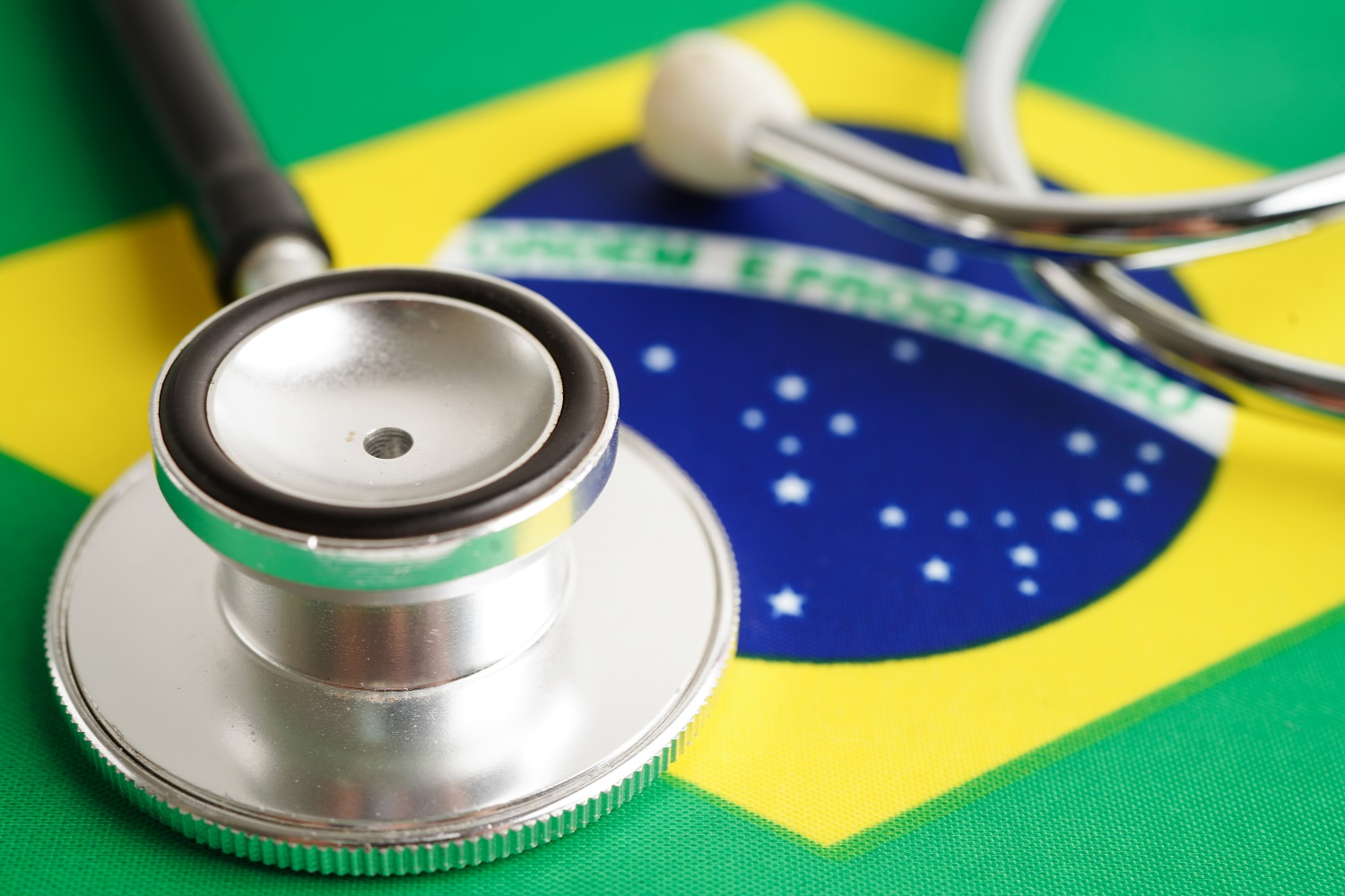 A stethoscope rests on the flag of Brazil.
