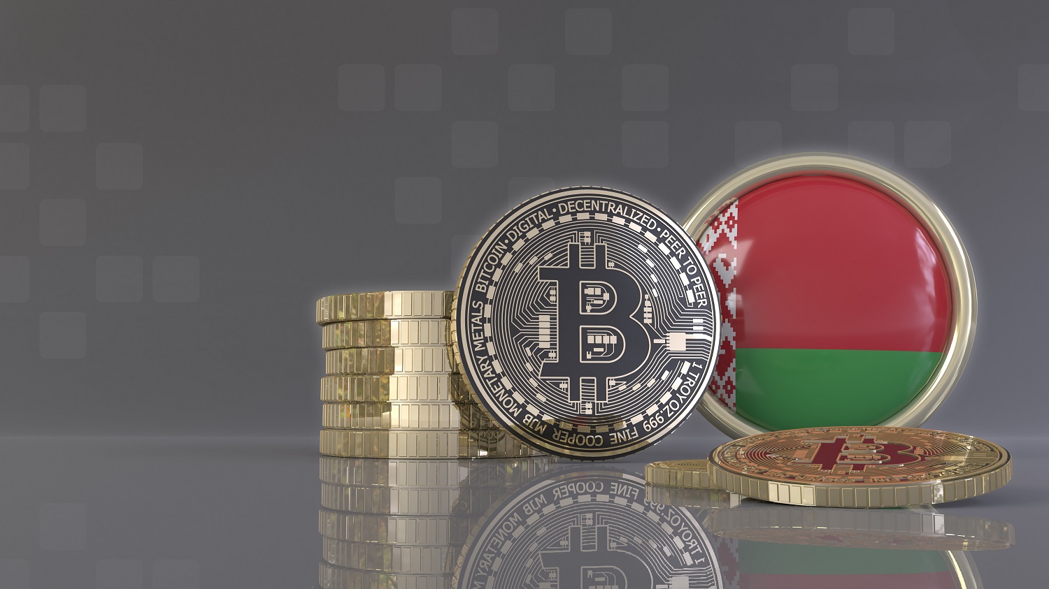 Metal tokens intended to represent Bitcoin, along with a badge decorated in the colors of the Belarusian flag.