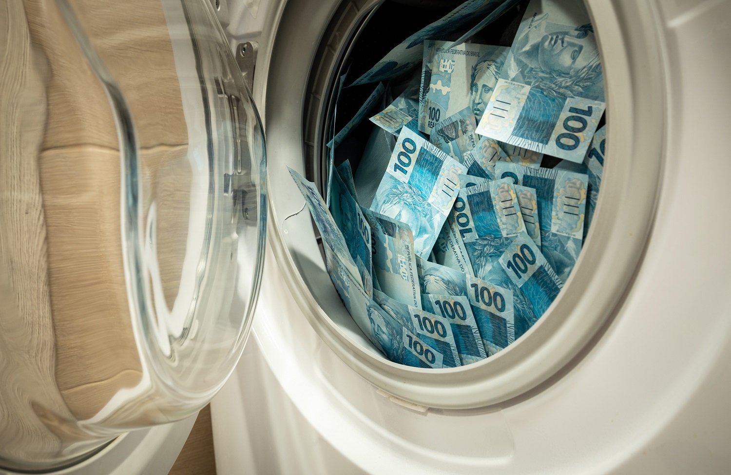 Brazilian banknotes stuffed into a washing machine.