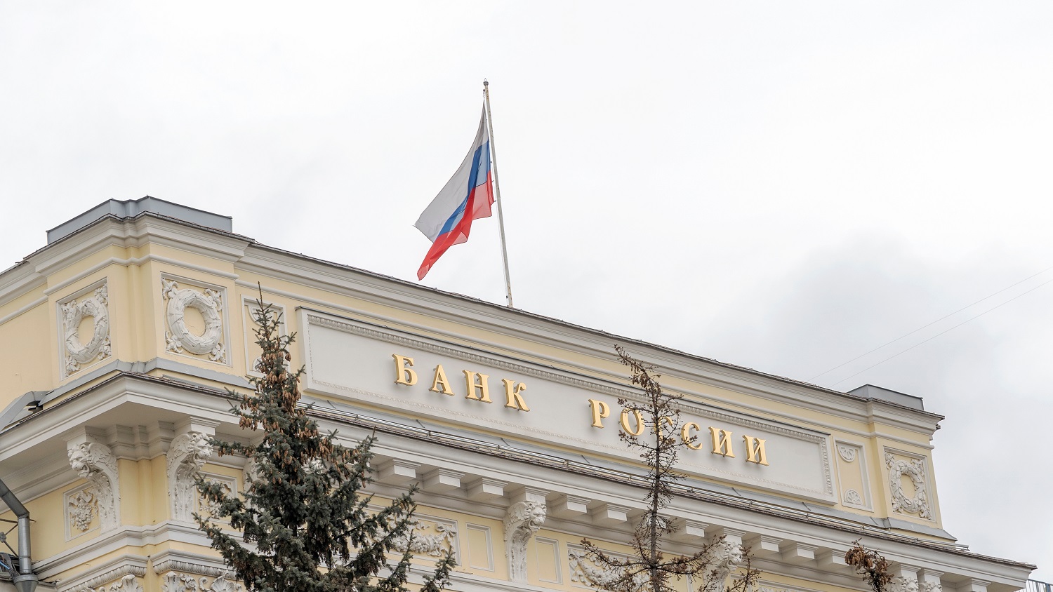 The Russian flag flies above the Central Bank of Russia, in Moscow, Russia.