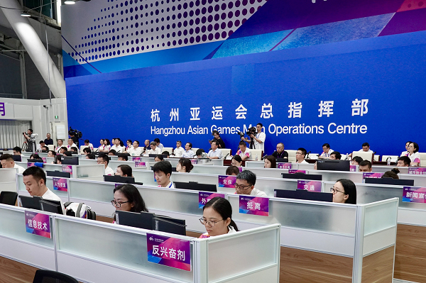 Staff work on computer terminals at the Hangzhou Asian Games Main Operations Centre during a pre-Asian Games drill.