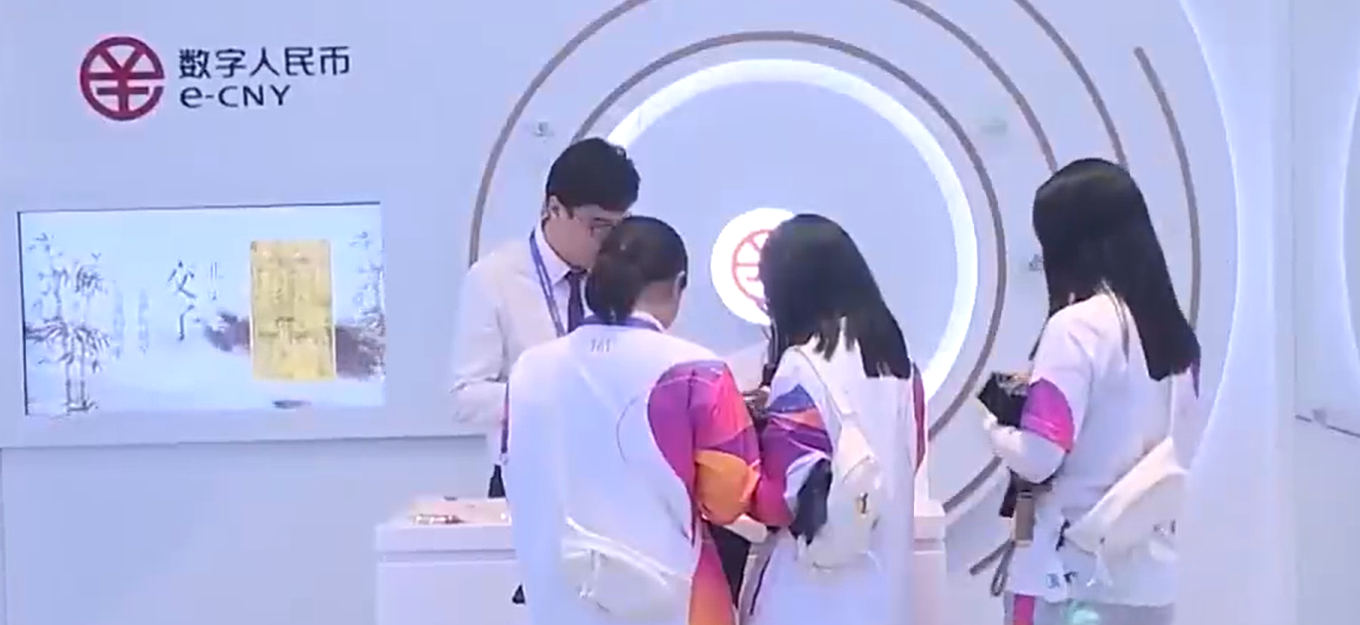 Athletes at an e-CNY “experience booth” at the Asian Games in Hangzhou, China.