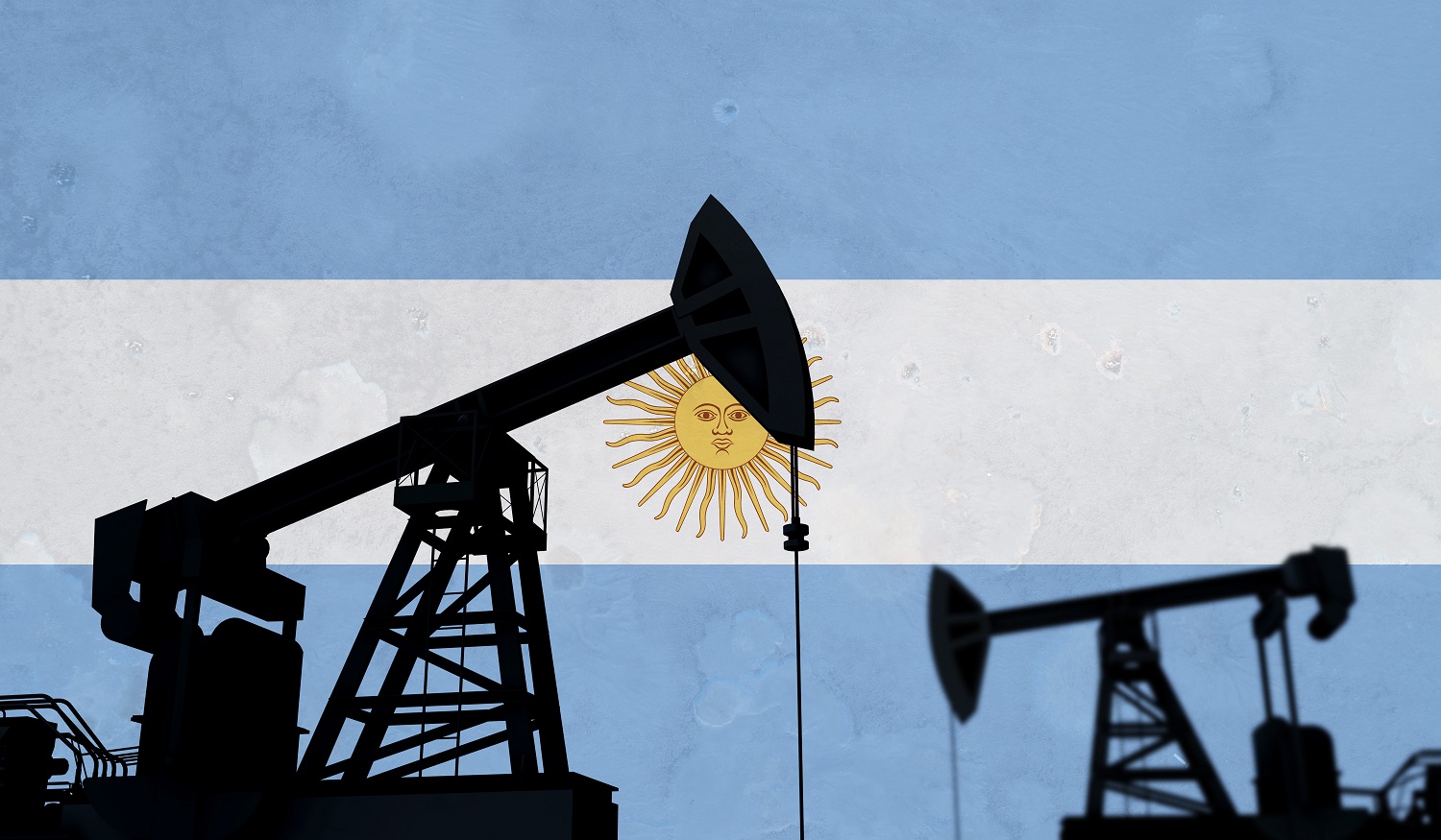 Oil pump silhouettes against the backdrop of the Argentinian flag.