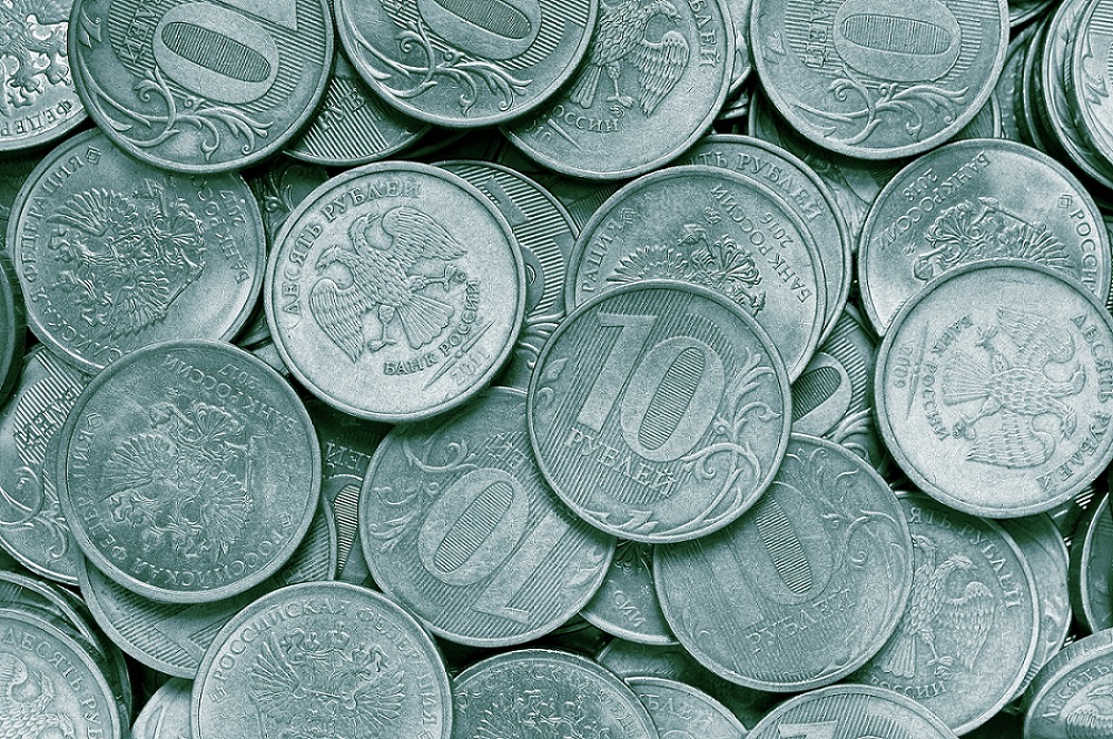 A surface covered with Russian 10 ruble coins.