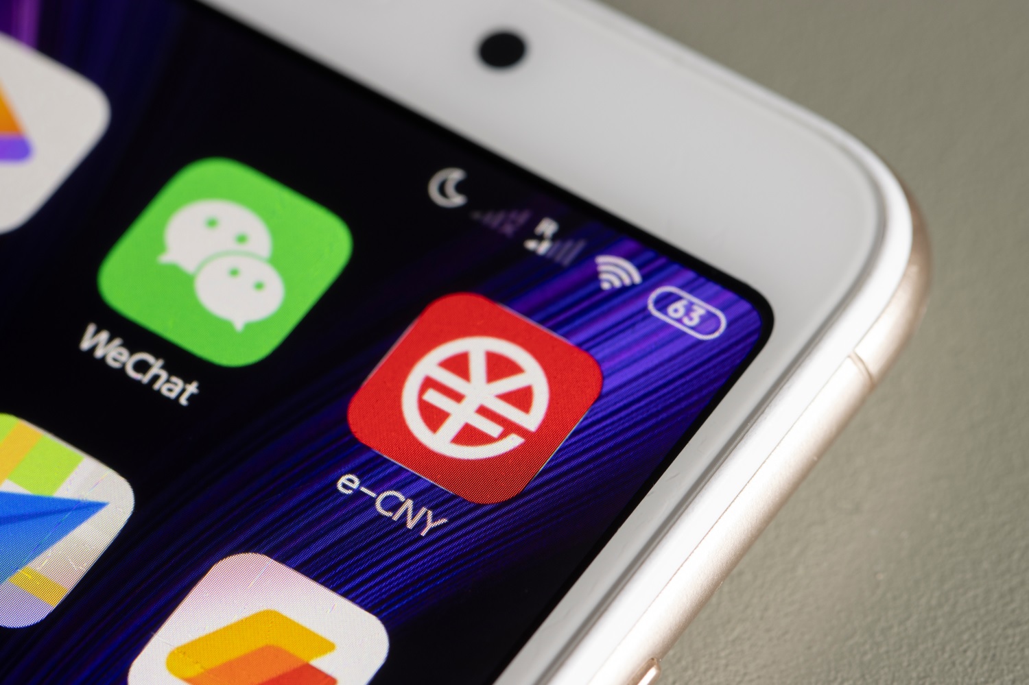 A smartphone screen displays a number of apps, including the Chinese central bank’s official e-CNY app.
