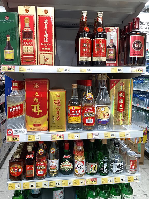 A selection of Chinese alcoholic beverages on sale in a store in Hong Kong, including Luzhou Laojiao baijiu.