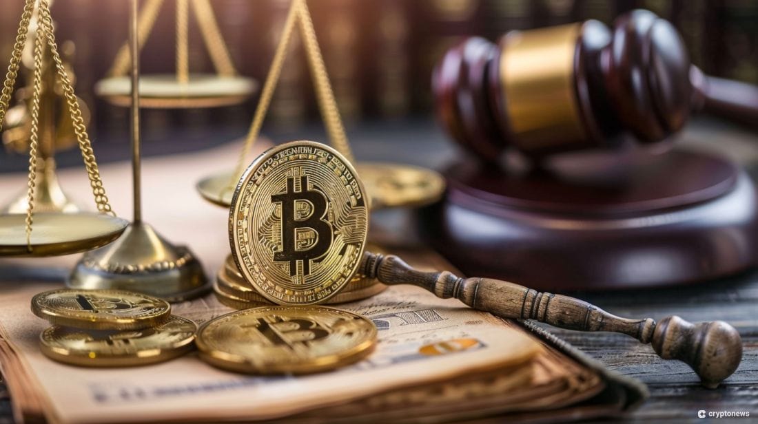 A gavel on a desk with cryptocurrencies.