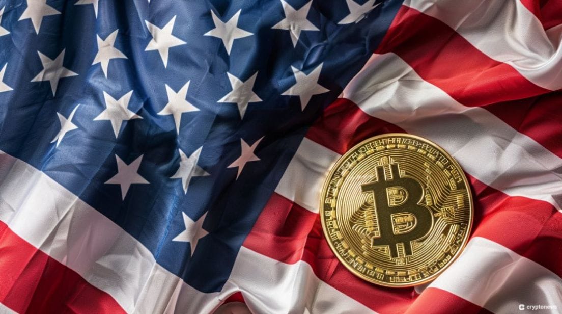 A Bitcoin rests on a rippled American flag, symbolizing the Donald Trump campaign's recent encounter with crypto scams targeting supporters.