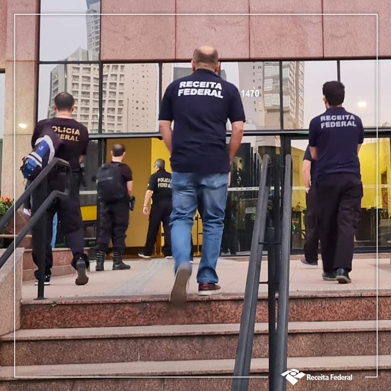 Brazilian Federal Police and tax officers search an address as part of the Operation Niflheim crackdown.