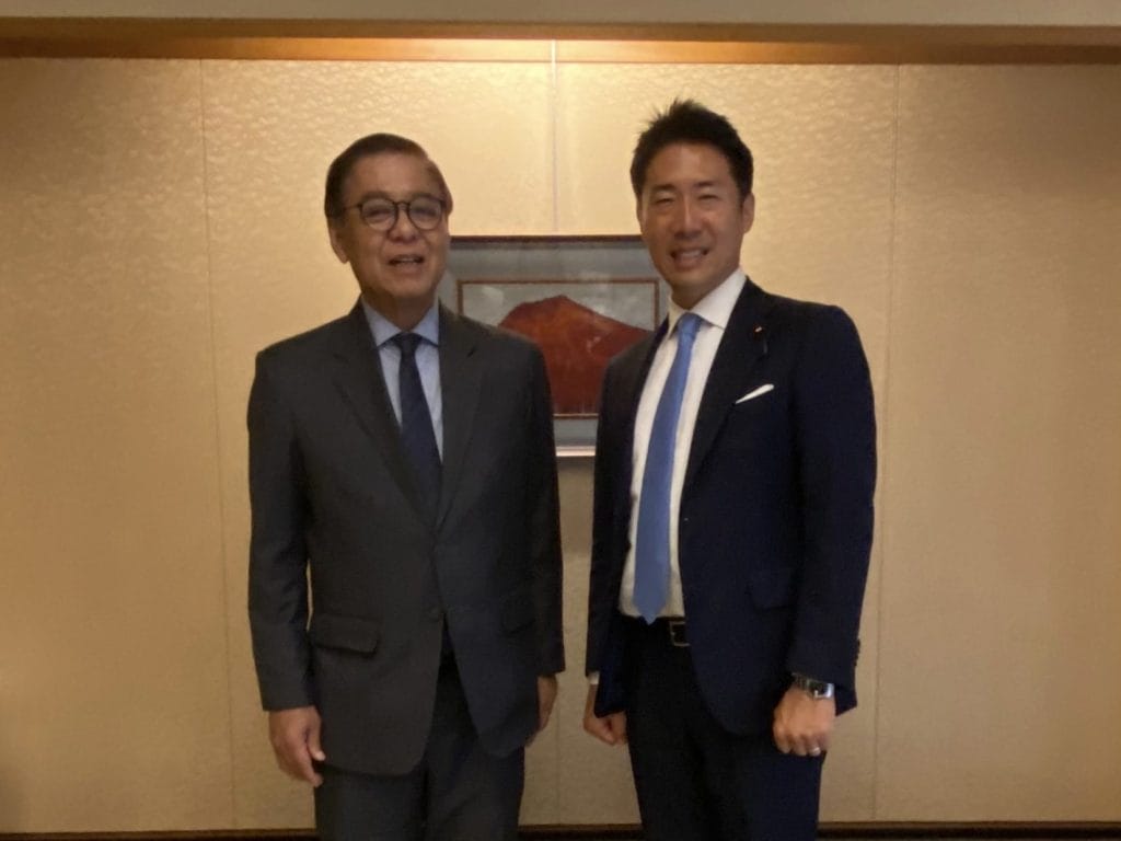 LDP lawmaker Akihisa Shiozaki with a Thai diplomat in October 2023.