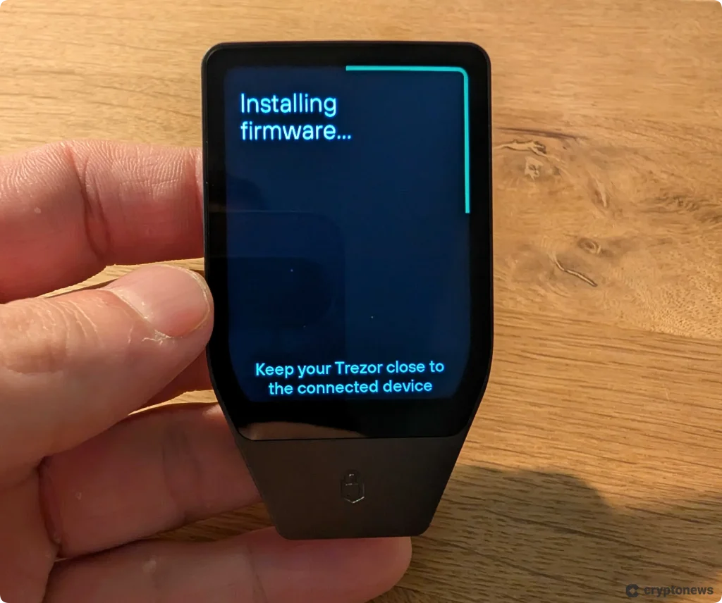 cryptonews researcher holding the new trezor safe 7 device