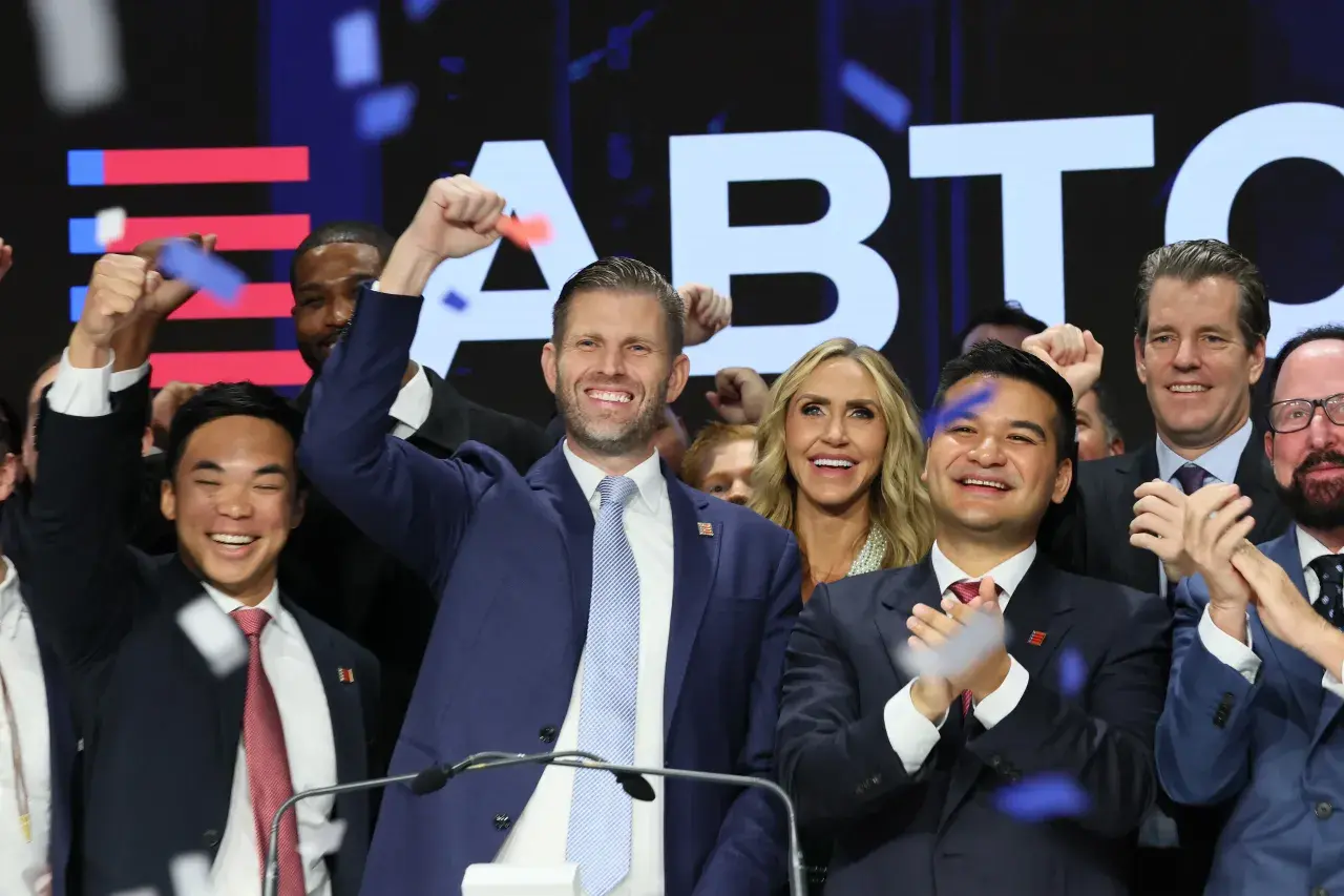 Donald Trump Jr. celebrates with supporters at a Bitcoin event with confetti.