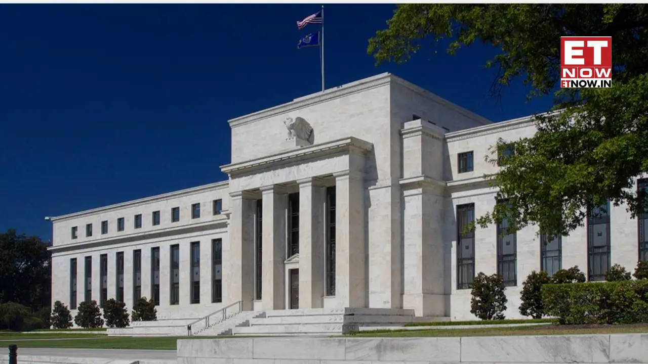 The exterior of the Federal Reserve Building, showcasing its architecture and flags.