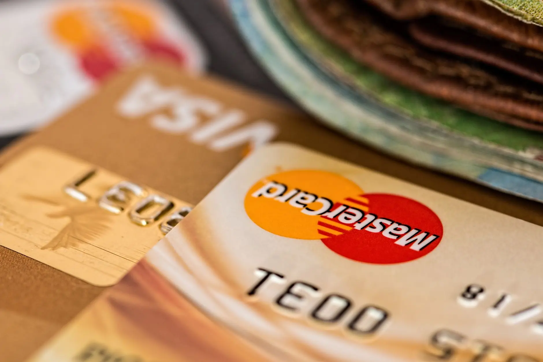 Close-up of Visa and Mastercard credit cards stacked together.