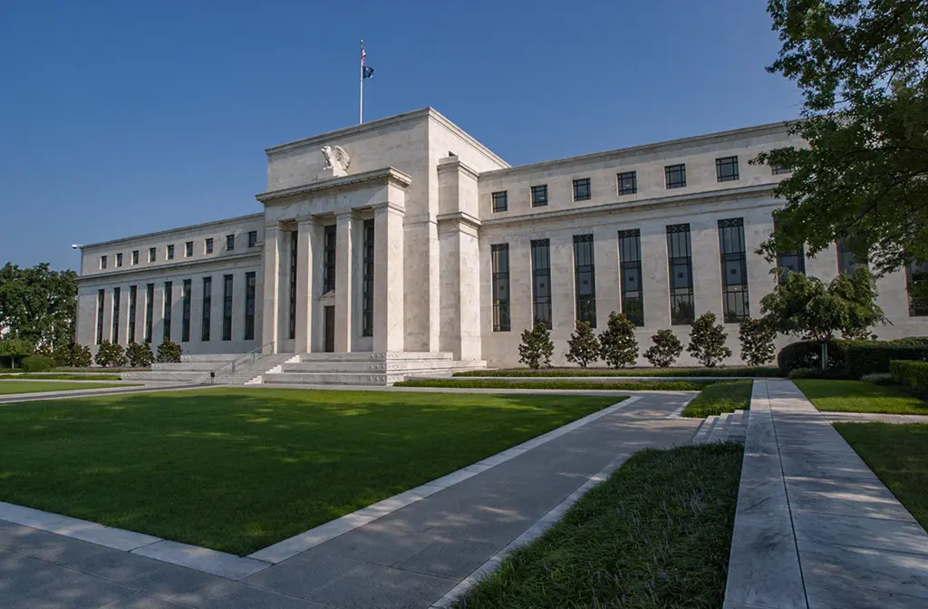 The Federal Reserve building in Washington DC with clear blue skies.