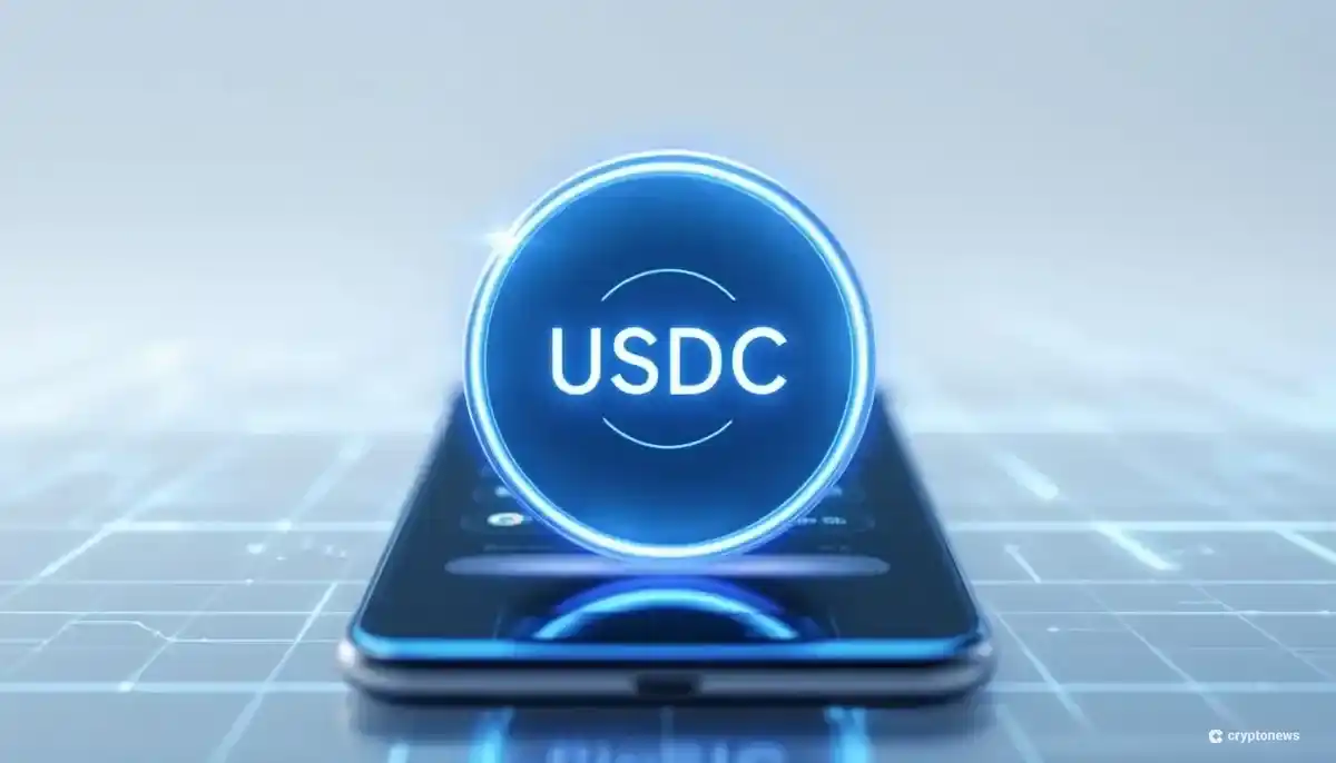 スマートフォンとUSDCコインのシンボルが描かれた未来的な画像