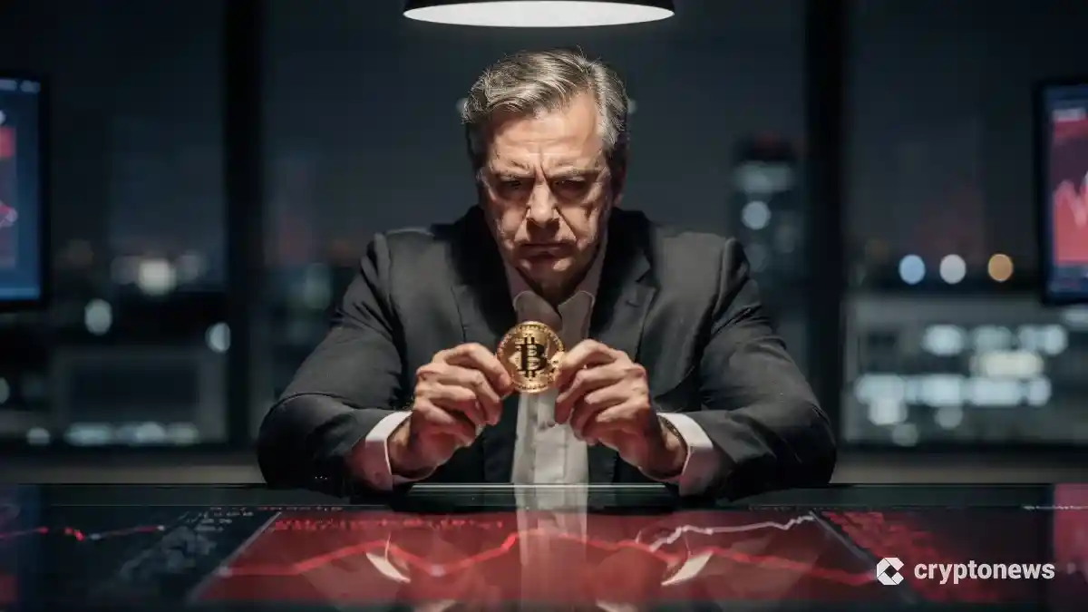 暗い役員室で深刻な表情をしてビットコインを見つめるビジネスマンと背景の赤い金融チャート