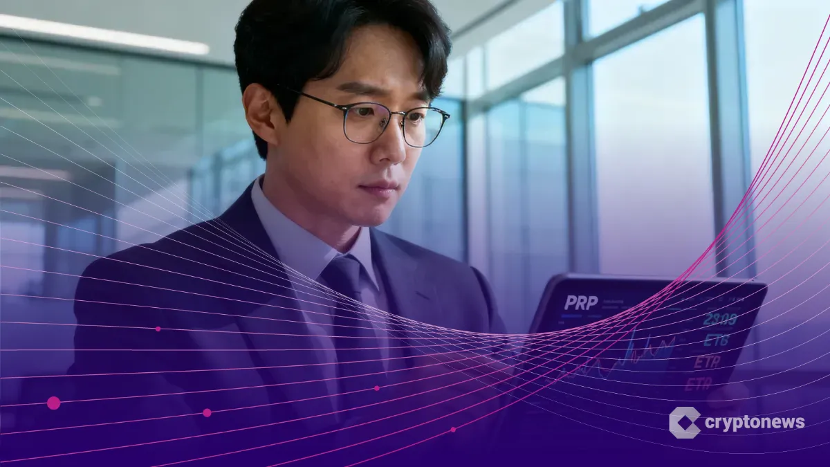 IQ276の世界記録保持者キム・ヨンフン氏がオフィスでXRPのチャートとETFデータを分析している