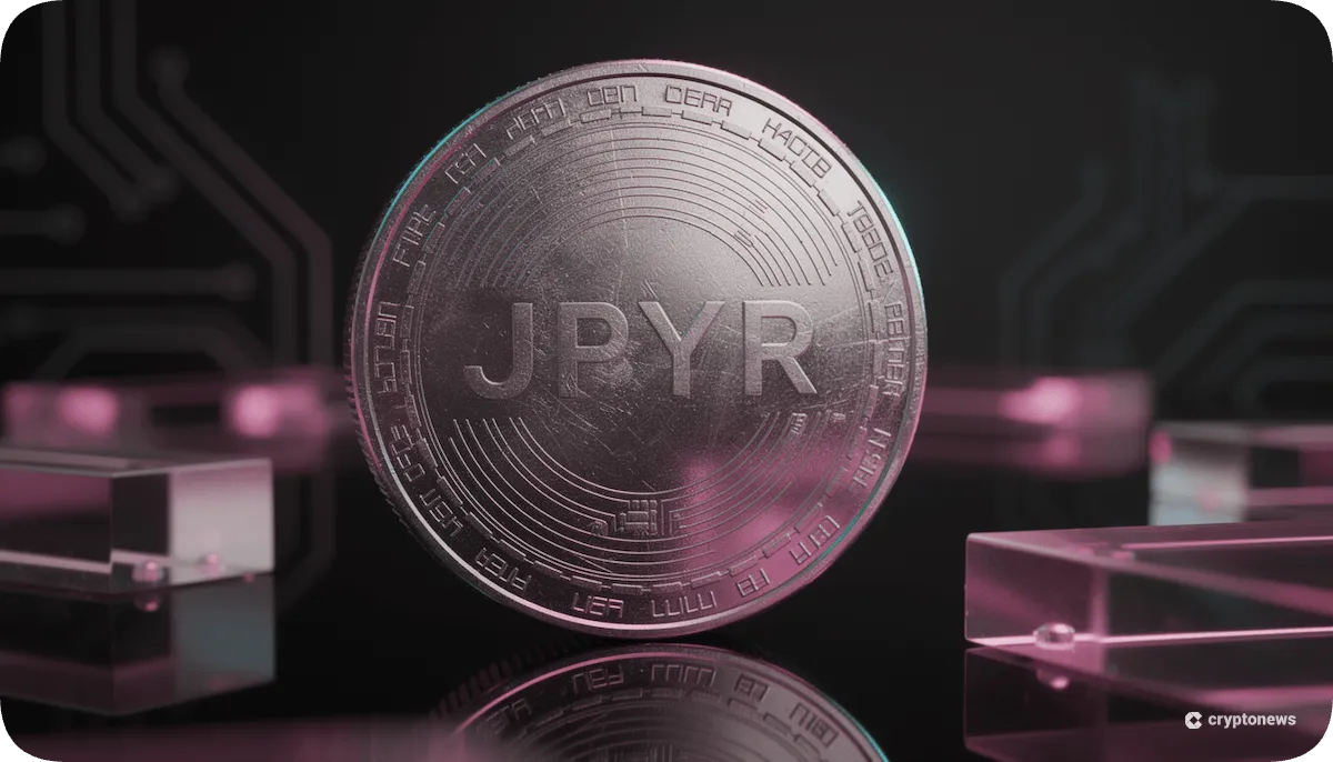 JPYRのロゴ入りコインが鏡面に立っている