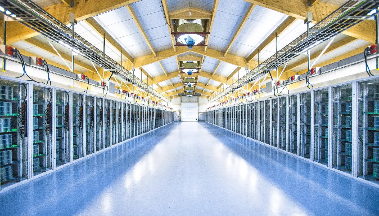 A large bitcoin mining hardware farm with rows of servers.