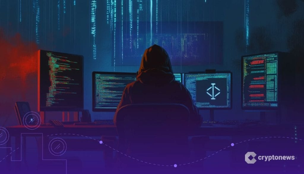 شخص يرتدي سترة ذات قبعة يجلس أمام العديد من شاشات الحاسوب
